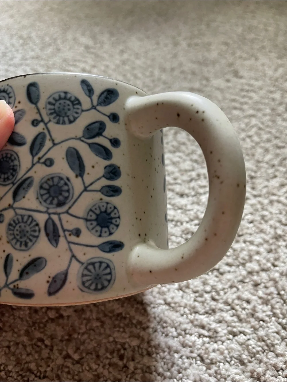 Speckled Ceramic Mug with Blue Floral Pattern